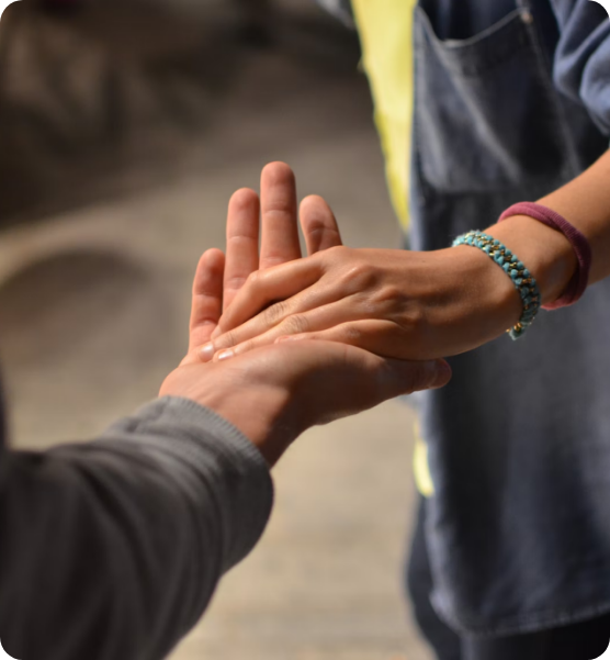 a photo of 2 peoples hands holding together
